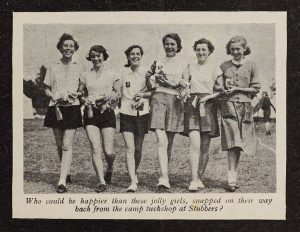A black and white photograph of six young women in civilian clothing. They are arm-in-arm and smiling. Underneath the image is a caption which reads 'Who could be happier than these jolly girls, snapped on their way back from the camp tuckshop at Stubbers?'.